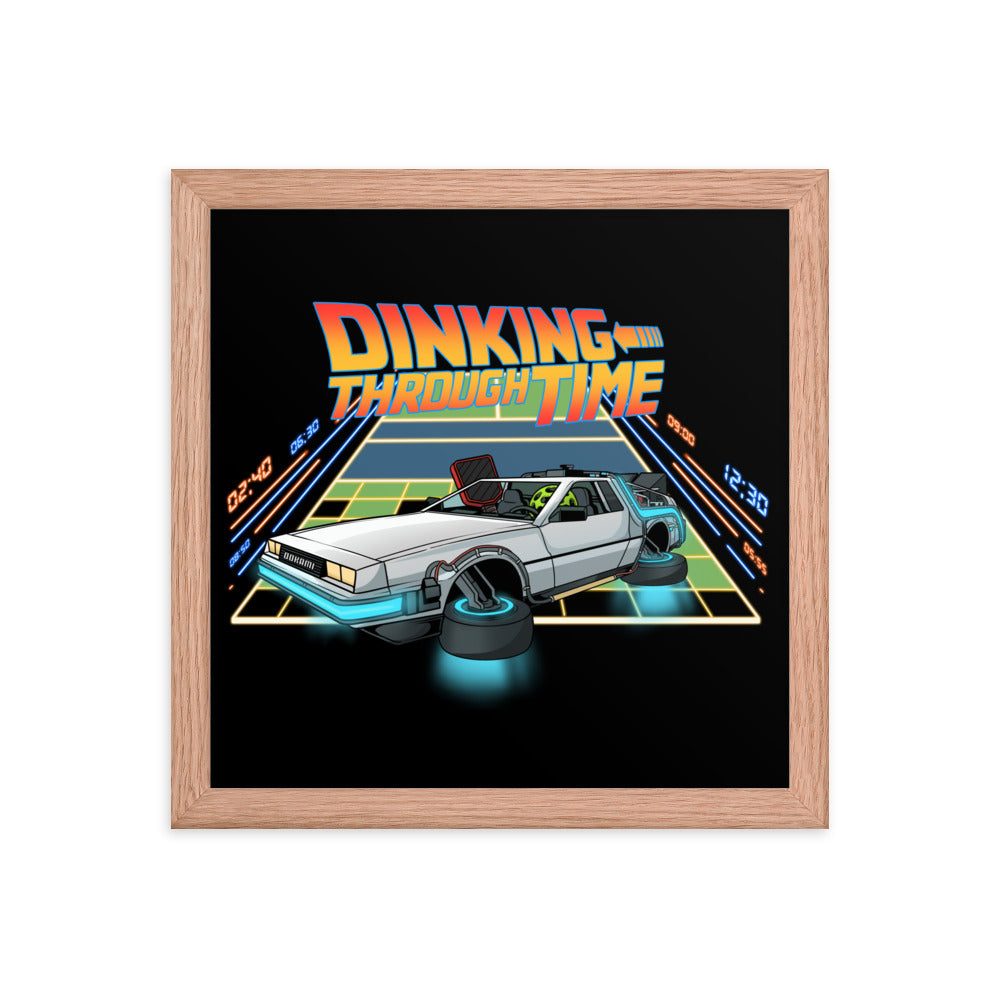 Framed poster of a DeLorean with the text 'Dinking Through Time' in a red oak frame, size 12x12 inches.