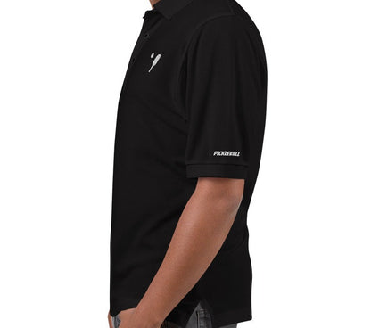 Side view of OOKAMI SPORTS Men's Premium Pickleball Polo in black, highlighting the metal buttons with dyed-to-match plastic rims and the side vents for breathability.