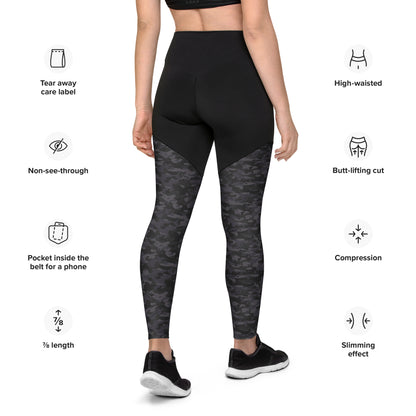 Back view of a woman wearing Stealth Camo Pickleball Sports Leggings with feature icons, highlighting the tear-away care label, non-see-through fabric, high-waisted design, butt-lifting cut, compression support, and a pocket inside the belt suitable for a phone.