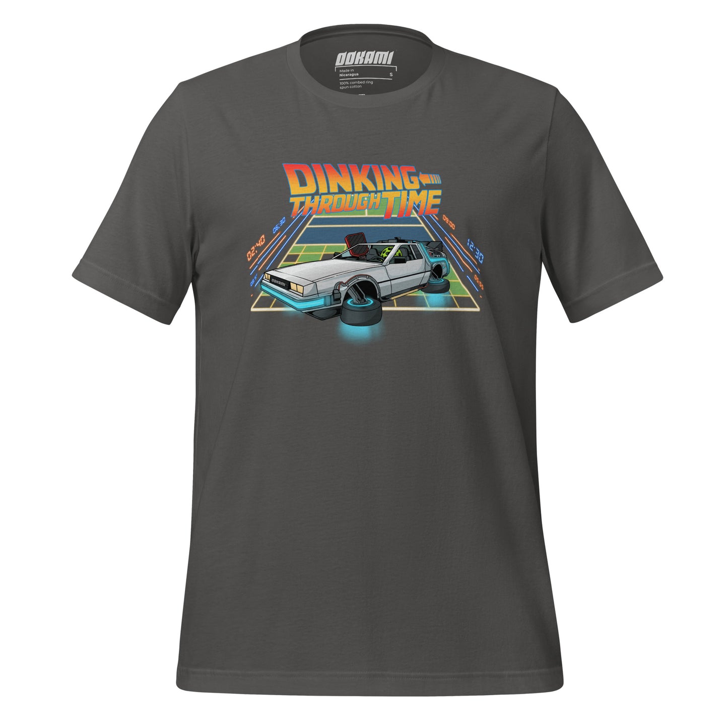 Charcoal pickleball T-shirt with a DeLorean parked on a court that merges into a neon grid, labeled 'Dinking Through Time' from OOKAMI SPORTS.