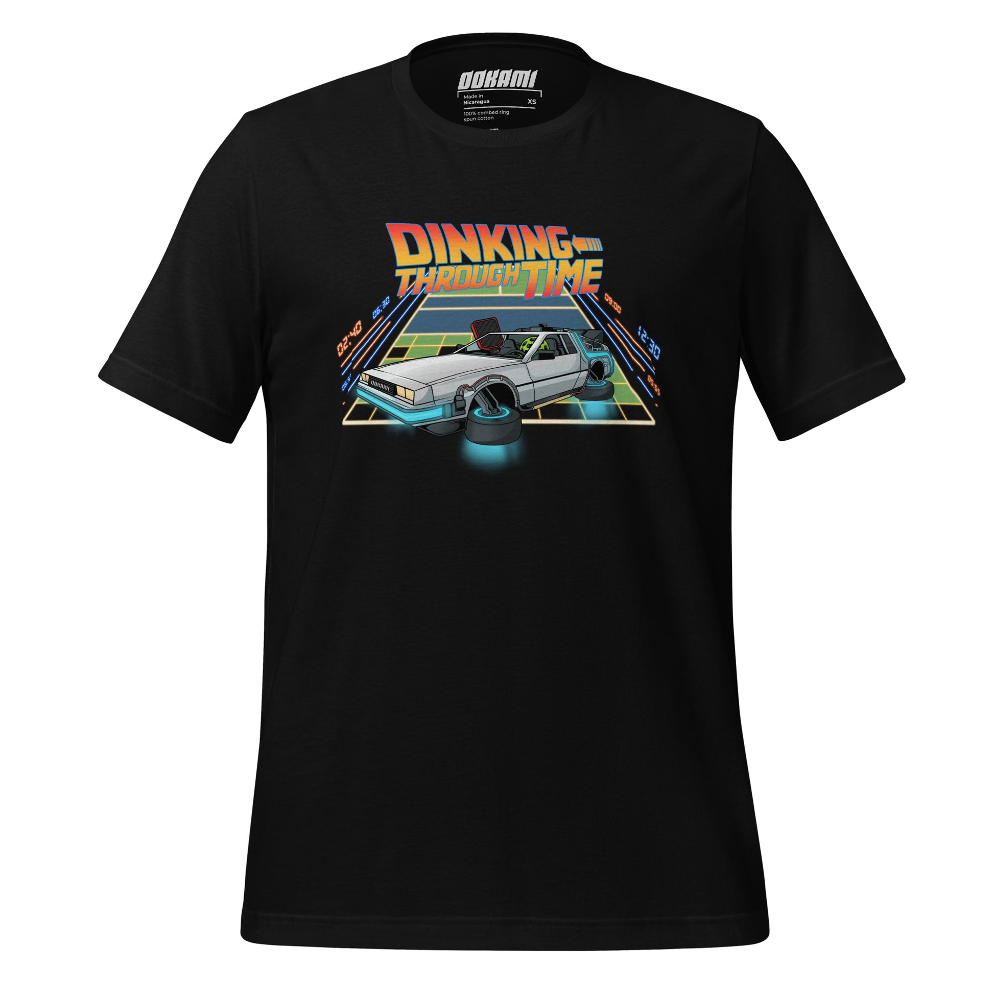 Black pickleball T-shirt with a front print of a DeLorean on a court that transitions into a neon grid, with 'Dinking Through Time' text from OOKAMI SPORTS.