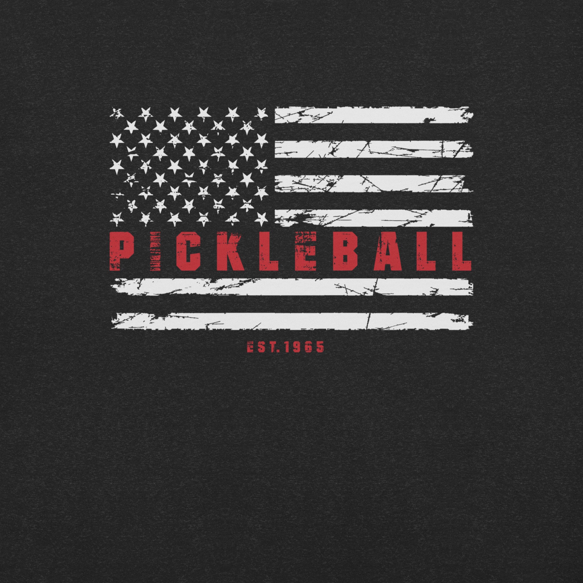 Close-up of the Patriotic Pickleball T-Shirt's front design featuring a distressed American flag with "Pickleball" and "Est. 1965".