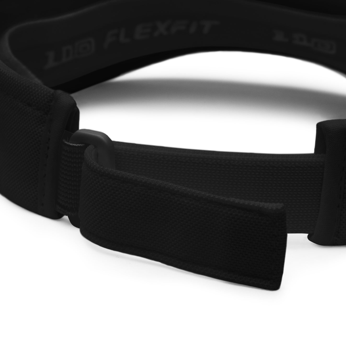 Close-up of the adjustable strap on a black FlexFit® visor, highlighting the FlexFit® branding and quality construction