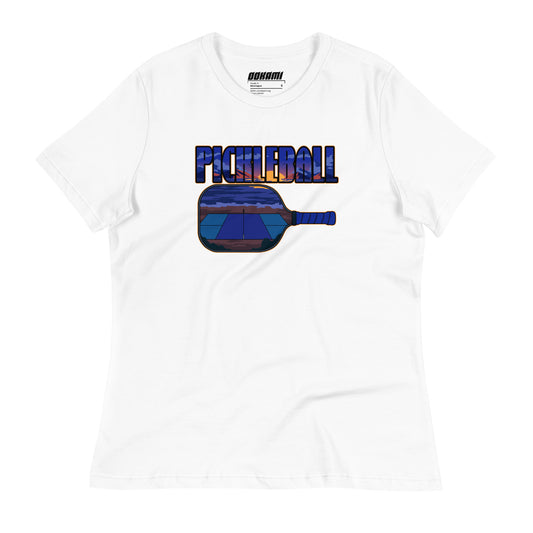 Front view of a white Women's Relaxed T-Shirt with a Sunset Pickleball Paddle design.